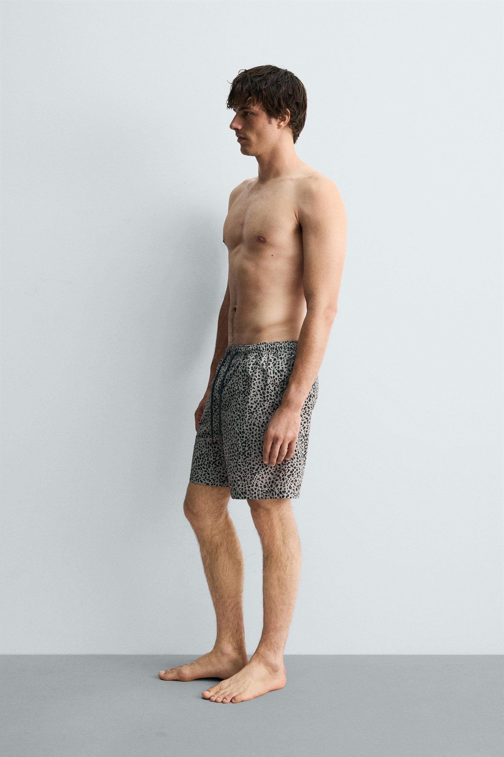 ANIMAL PRINT LONG SWIM TRUNKS